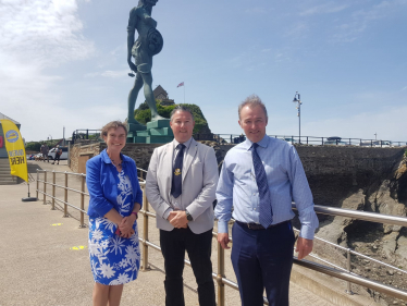 Selaine Saxby standing in front of the Verity statue in Ilfracombe